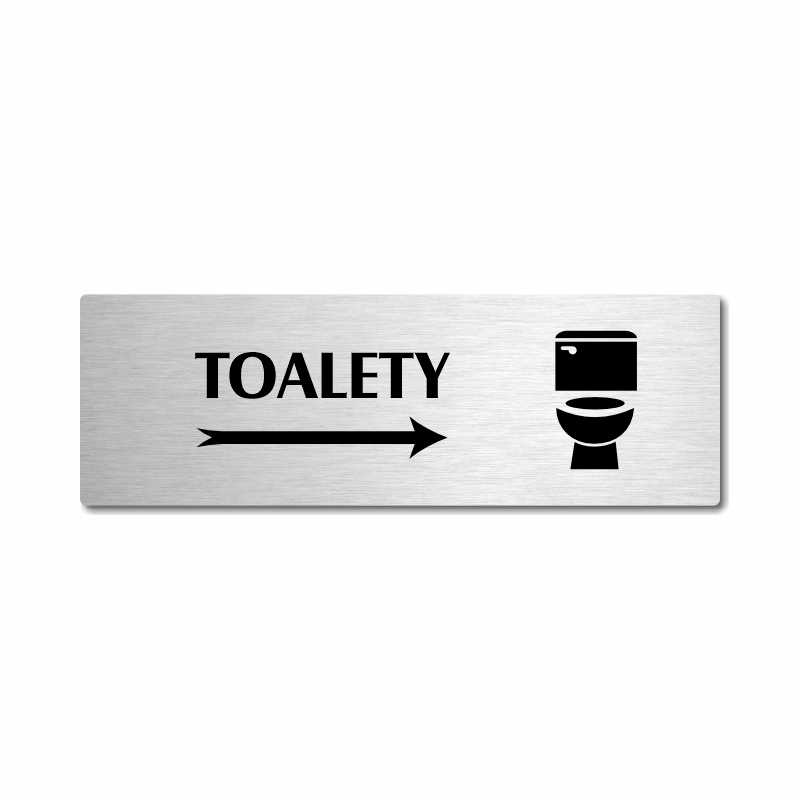 Toalety vpravo, stříbrná popiska na dveře